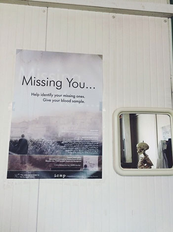 Poster recruiting people to give DNA samples to help with the ongoing process of identifying all the recovered remains at The International Commission on Missing Persons (ICMP) in Tuzla, Bosnia – Source: Sarah Reichenbach, The Advocacy Project, June 2015