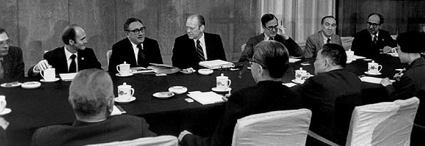 Secretary of State Henry Kissinger, President Gerald Ford, Ambassador George Bush, and the president's staff meet with Vice-Premier Deng Xiaoping in Beijing on December 4, 1975 (Gerald R. Ford Library).