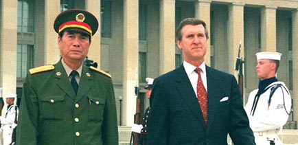 Secretary of Defense William Cohen escorts General Zhang Wannian to the Pentagon parade field on September 15, 1998 (Department of Defense).